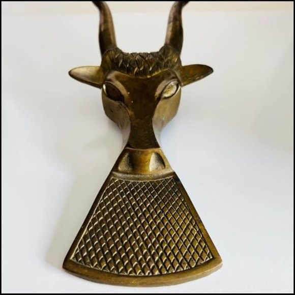 Vintage brass bull head boot jack. Could also be used as a doorstop